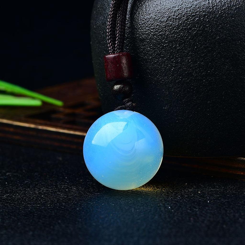Blue Opalite Crystal Sphere Pendant Black Background