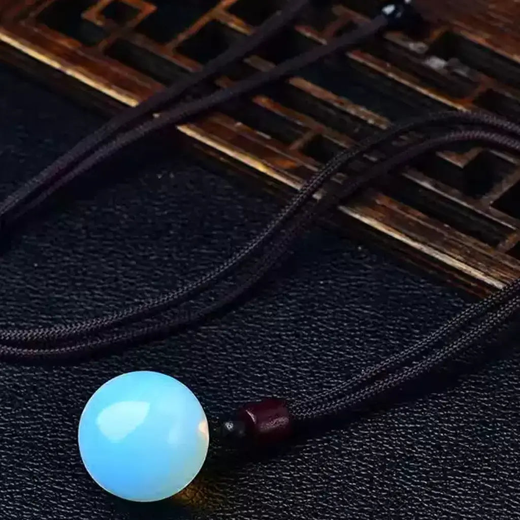 Blue Opalite Crystal Sphere Pendant Black Background  Blue Opalite Sphere Pendant Cord Necklace