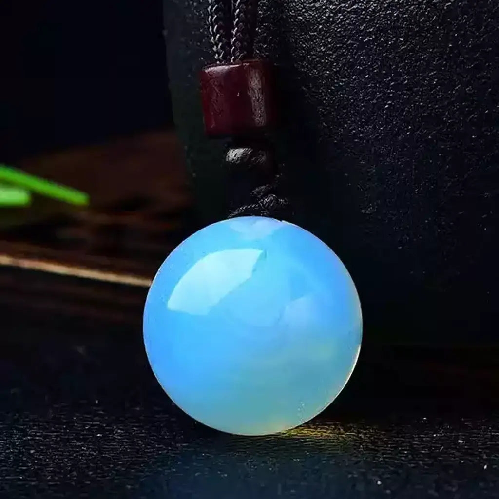 Blue Opalite Crystal Sphere Pendant Black Background