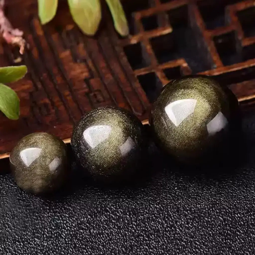 Golden Sheen Obsidian Sphere Size Comparison