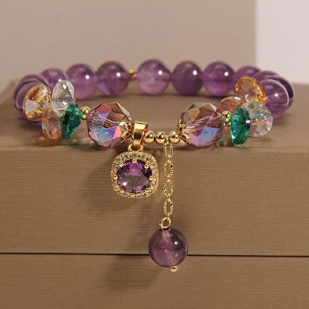Gift-ready amethyst crystal bracelet on a brown box