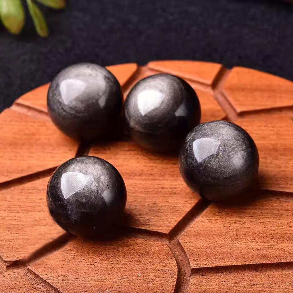 Black Obsidian Crystal Spheres on Wood