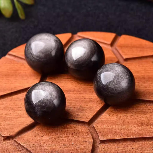 Black Obsidian Crystal Spheres on Wood