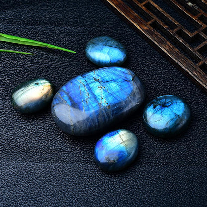 Blue Labradorite Palm Stones Black Background