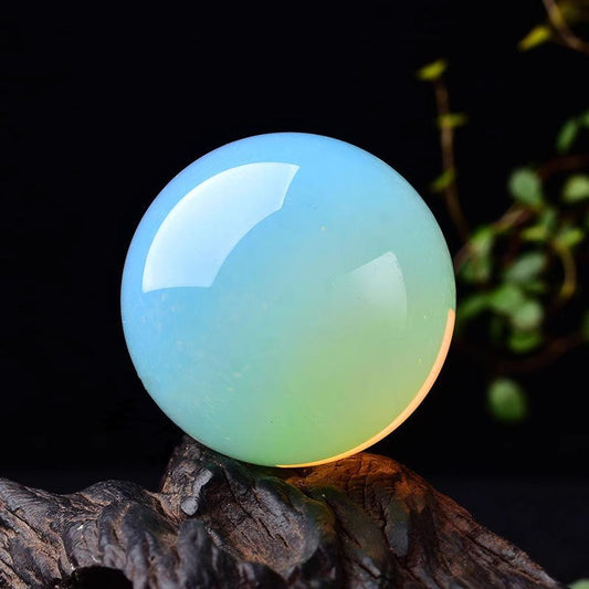 Blue Opal Crystal Sphere on Wood