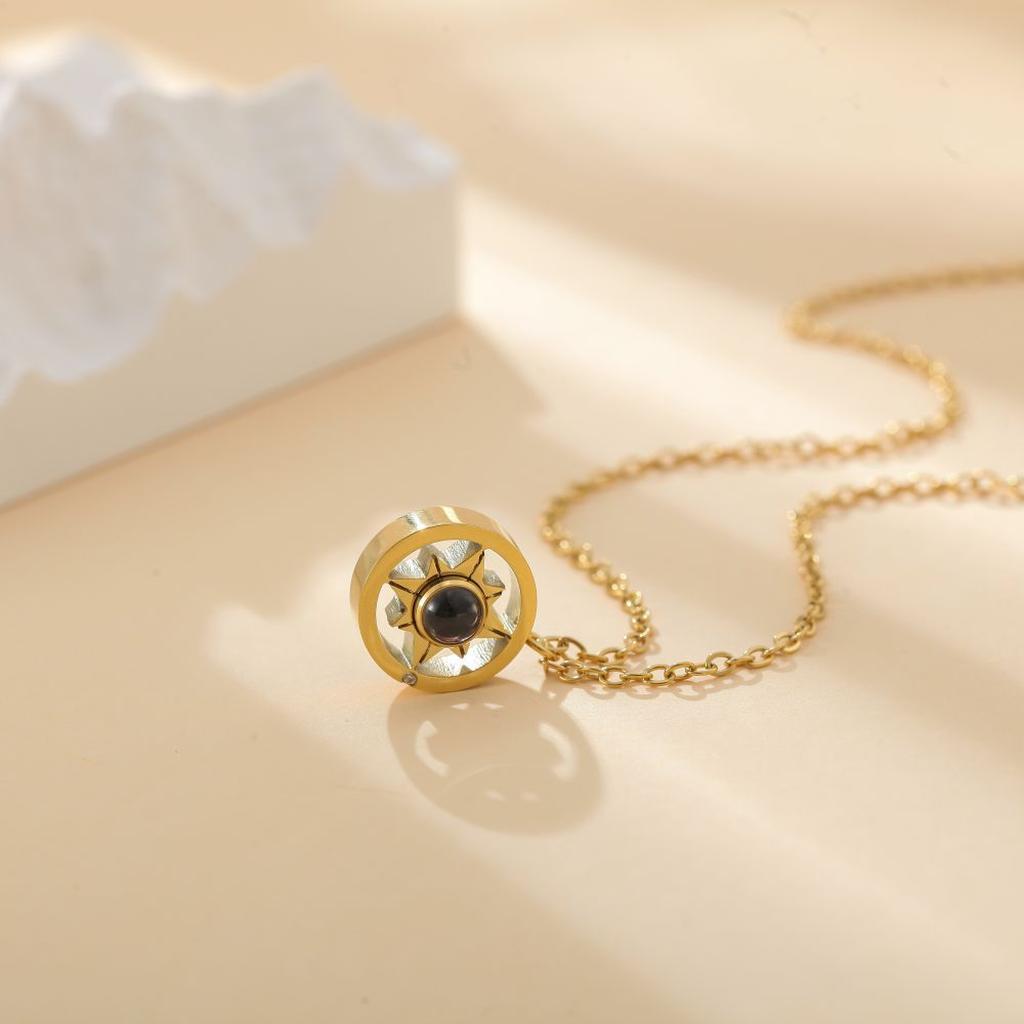 Gold Sun Photo Projection Necklace Flatlay