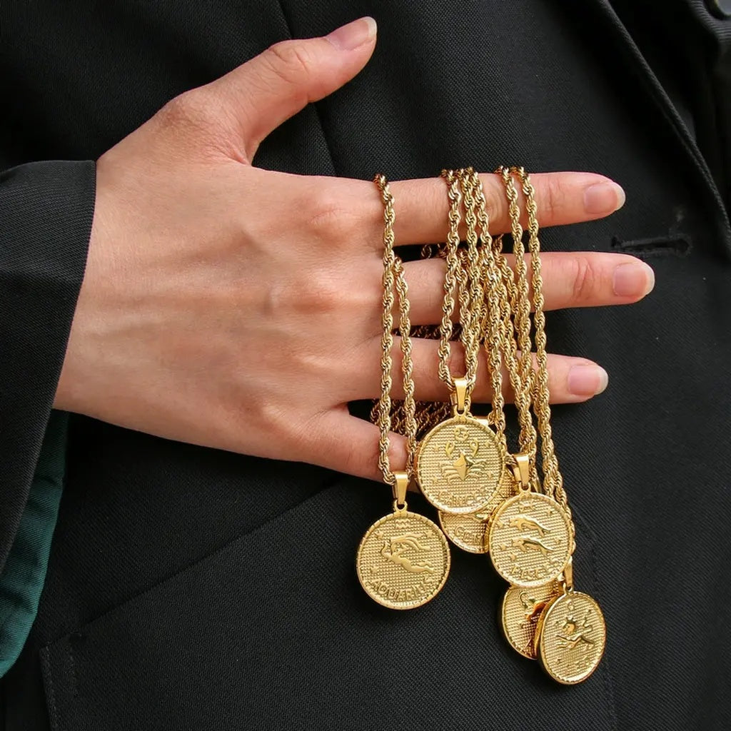 Gold Zodiac Sign Necklaces on Hand Display