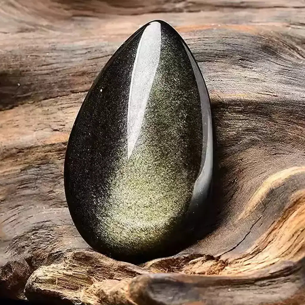 Golden Sheen Obsidian Cabochon Wood Background