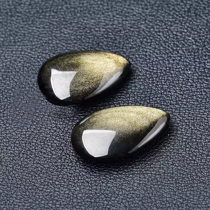 Golden Sheen Obsidian Cabochons Black Background