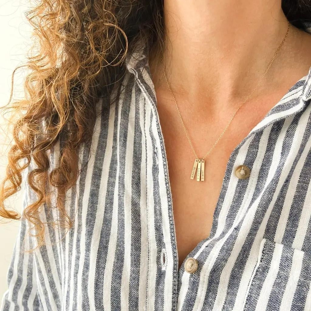 Personalized Gold Name Necklace on Striped Shirt
