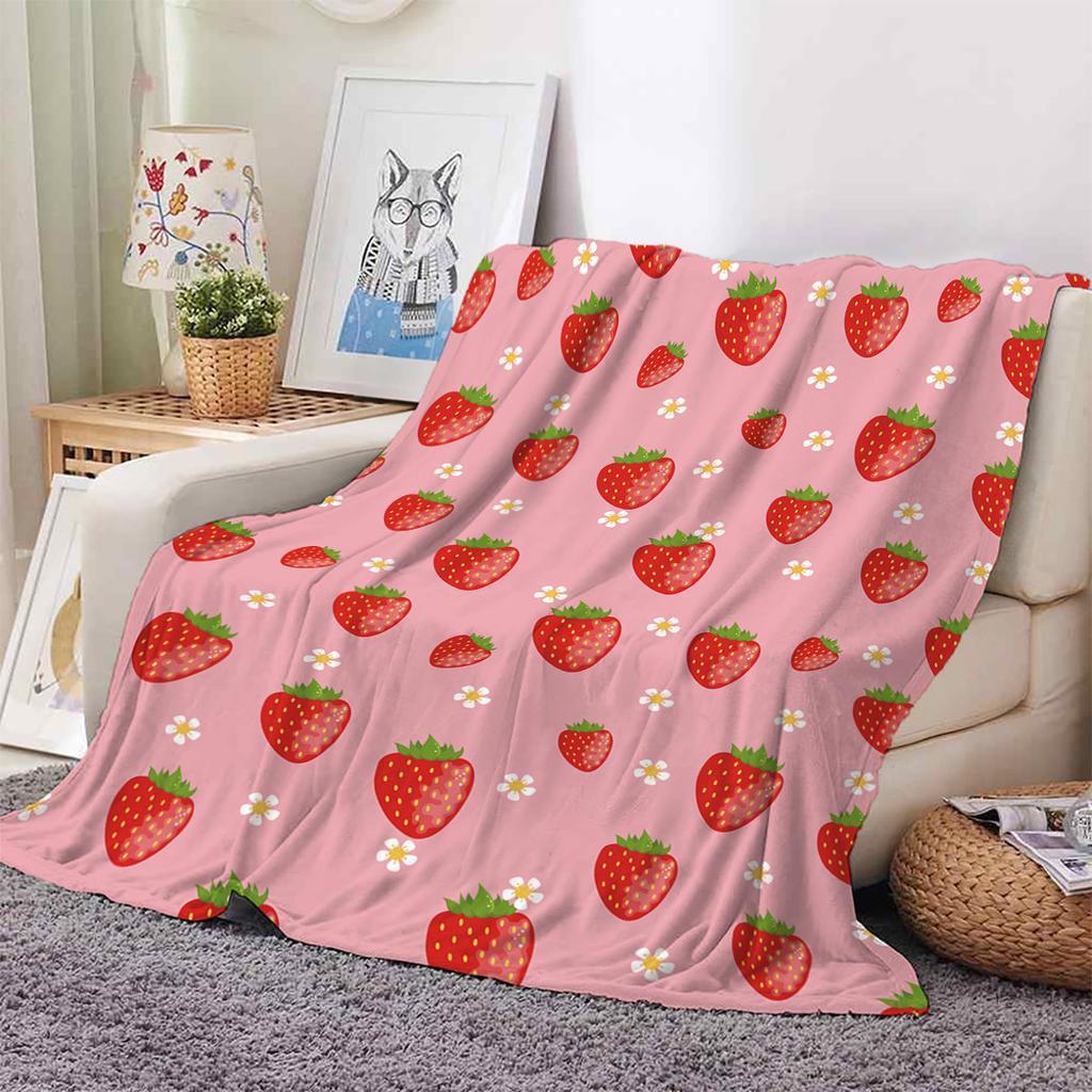 Pink Strawberry Print Fleece Blanket on Sofa