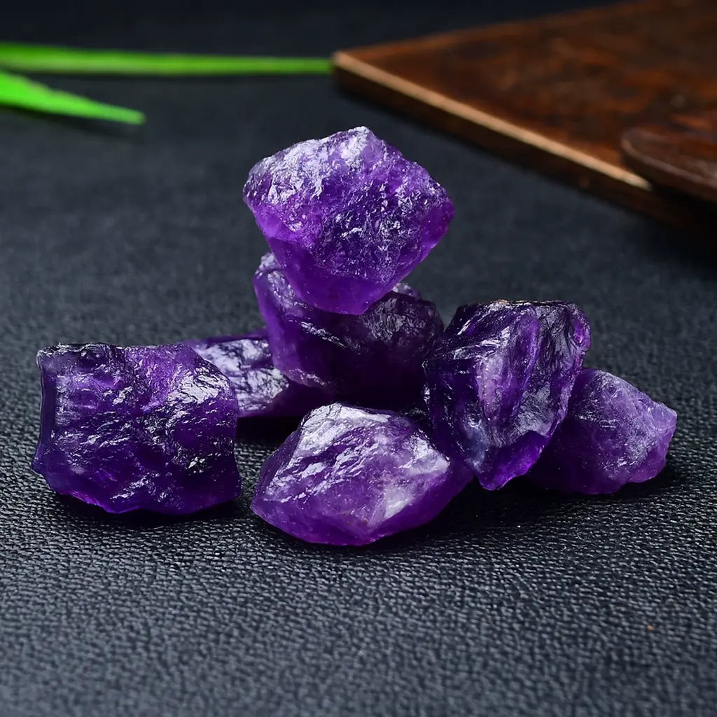 Raw Amethyst Crystal Cluster On Black Background
