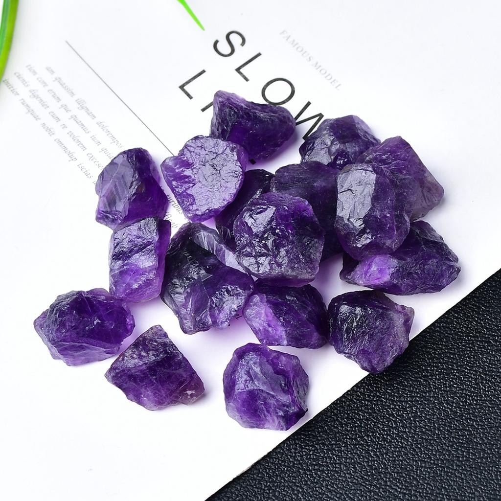 Raw Amethyst Crystal Collection on White Paper