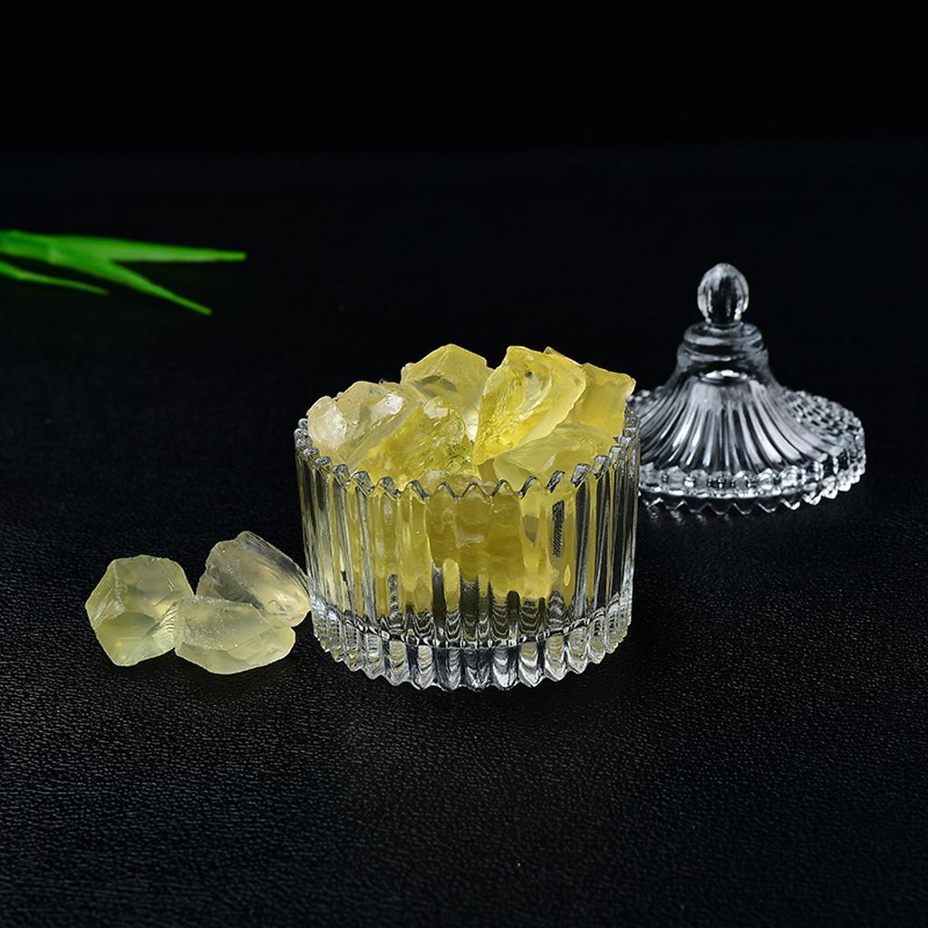 Raw Citrine Crystals Glass Jar Black Background