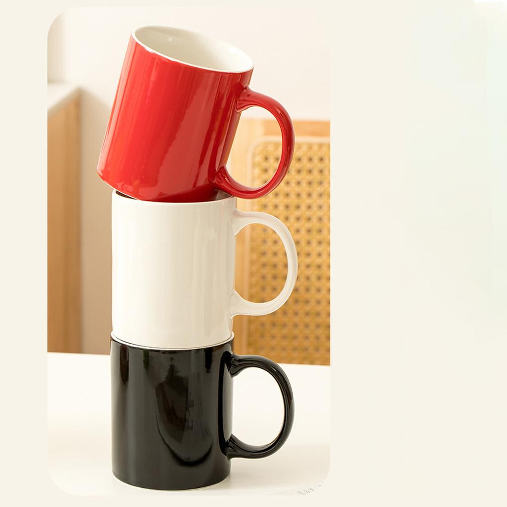 Stacked Red White And Black Coffee Mugs