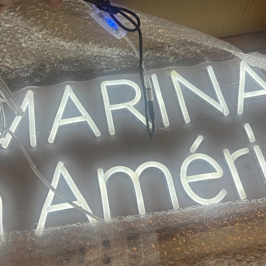 White Neon Marina Sign