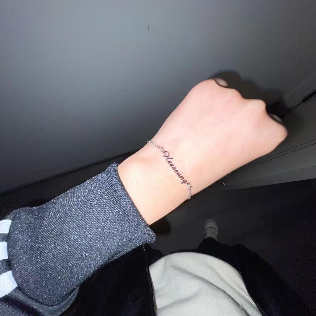 personalized name bracelet on wrist custom jewelry closeup.jpg